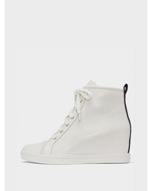 dkny slip on trainers white