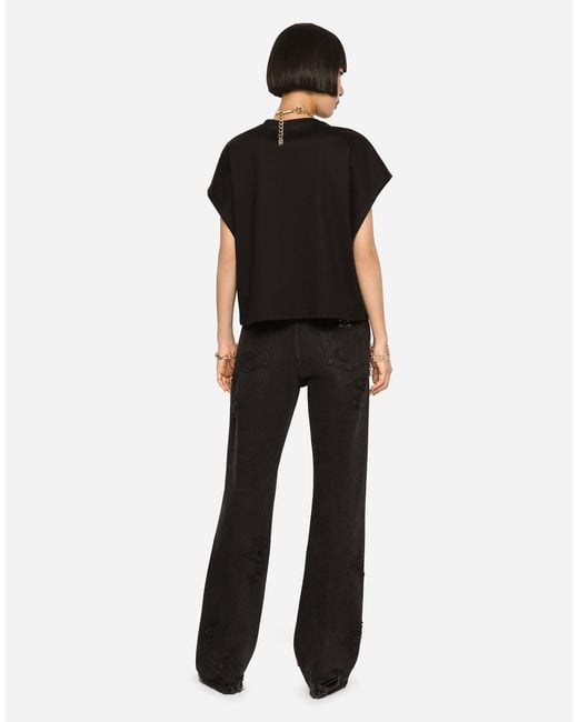 Dolce & Gabbana Black Flared Jeans With Ripped Details