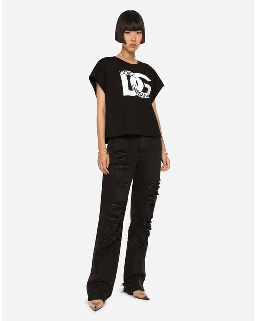 Dolce & Gabbana Black Flared Jeans With Ripped Details