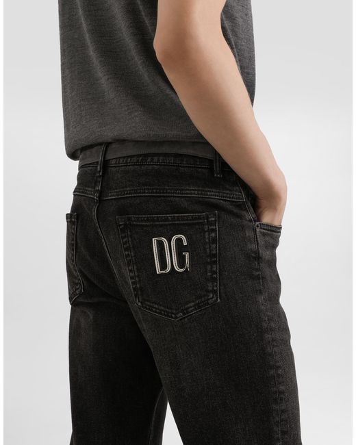 Dolce & Gabbana Black Denim Trousers With Dg Patch for men