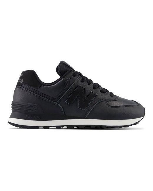 New Balance 574 Trainers in Black Lyst