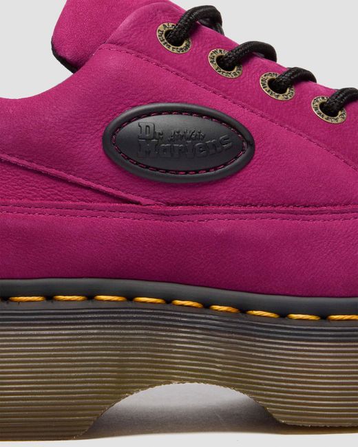 Chaussures buzz Dr. Martens en coloris Pink