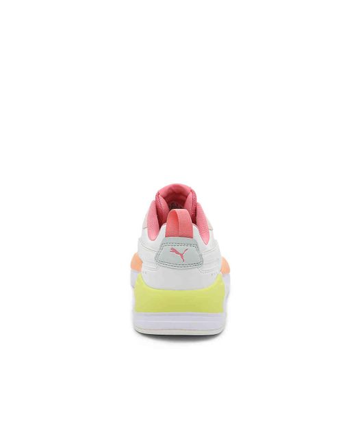 lime green and pink pumas