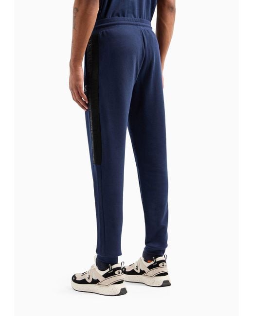 Pantaloni Jogger Logo Series In Cotone di EA7 in Blue da Uomo