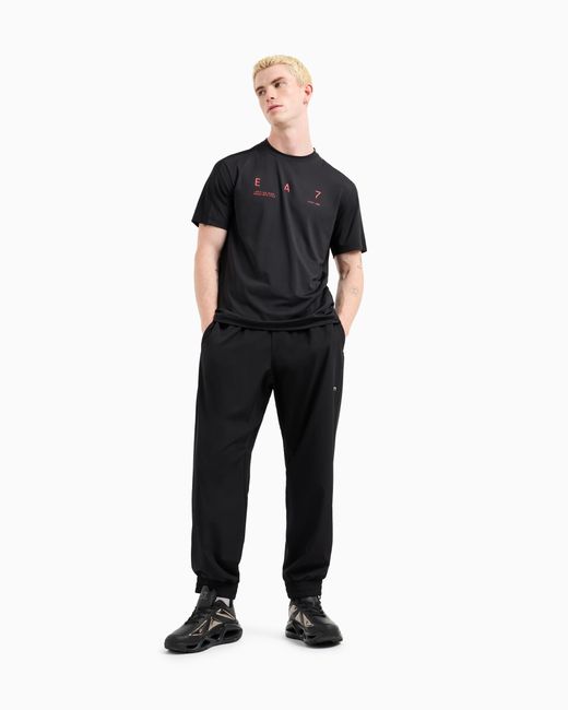 EA7 Graphic Series Jogginghose Aus Elastischem Funktionsgewebe in Black für Herren