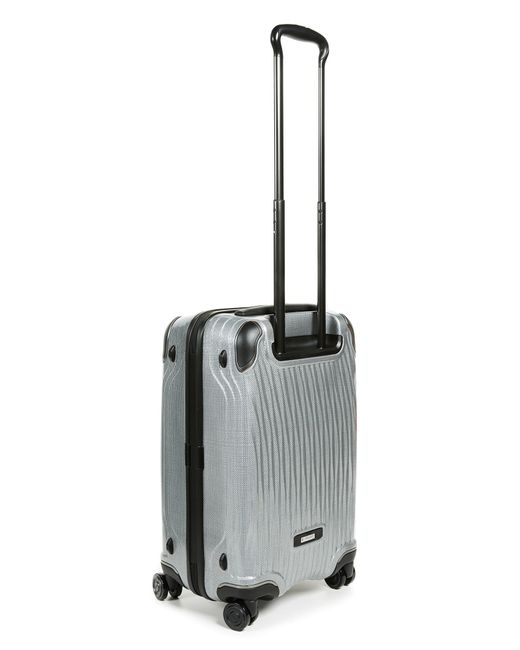 tumi silver suitcase
