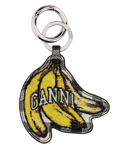 Ganni Metallic Banana Shaped Keyring With Logo Lettering On The Front