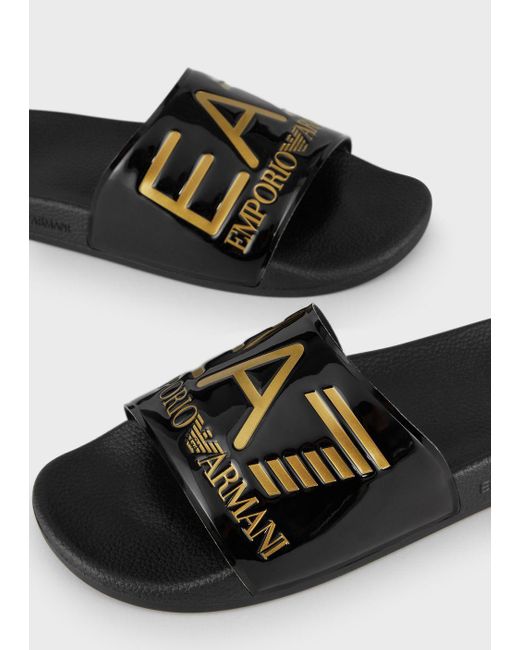 black and gold armani sliders