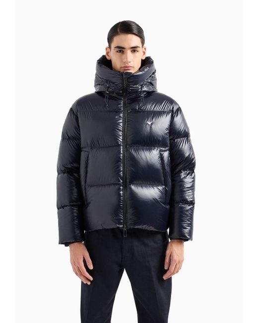 Water-repellent quilted down jacket in light wool with sailing patch