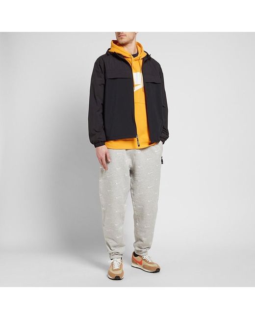 nike swoosh all over pants