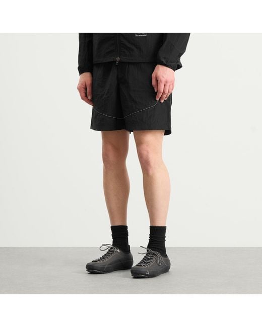 And Wander Black X Roa Ripstop Wind Shorts for men