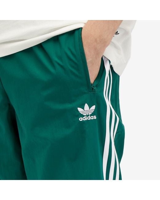 Adidas Green Woven Firebird Track Pant for men