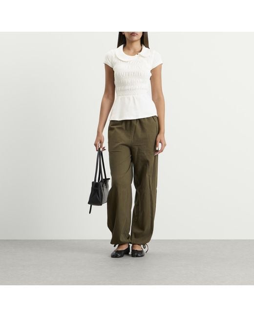 Peachy Den White Ferdinand Polo Top