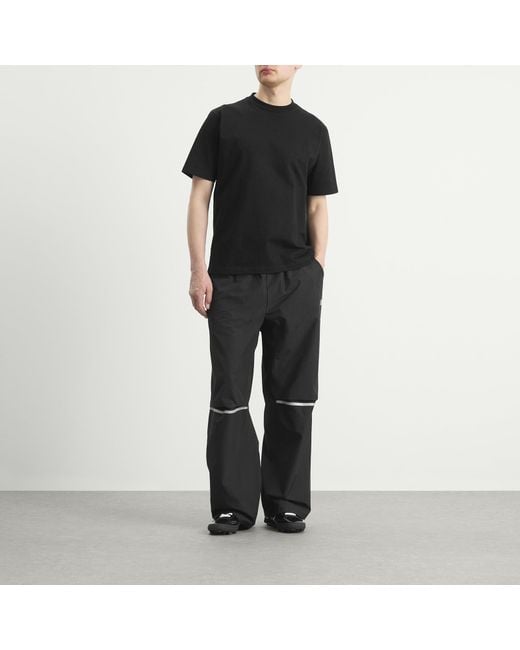 New Balance Black Elusive Shell Pant for men