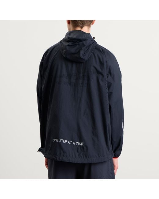 And Wander Blue X Altra Ventilation Wind Jacket for men
