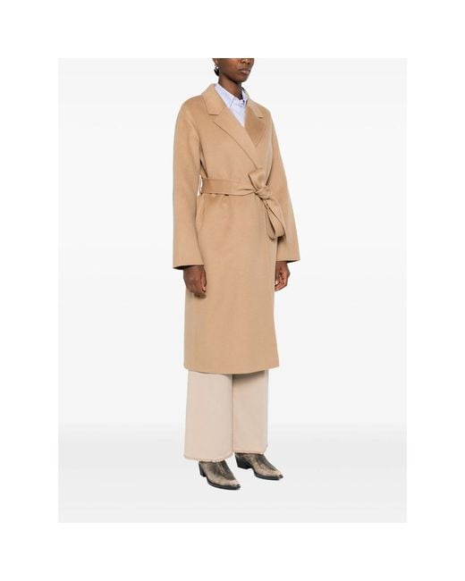 The Dynamis Studio Natural Belted Long-Sleeved Coat