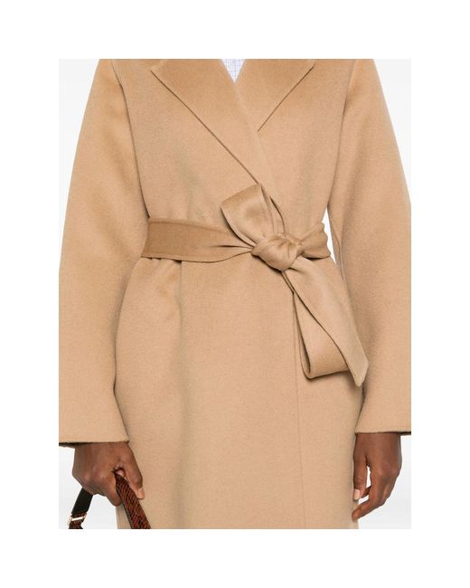 The Dynamis Studio Natural Belted Long-Sleeved Coat