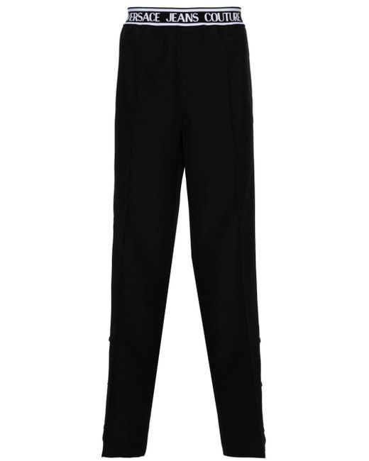 Pantaloni dritti con banda logo di Versace in Black da Uomo