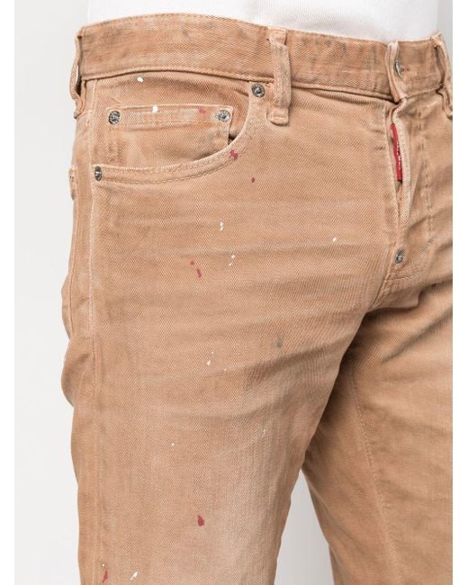 Paint splatter skinny jeans di DSquared² in Natural da Uomo
