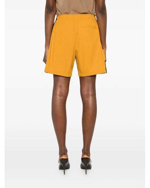 Saint Laurent Orange Cassandre Logo Shorts
