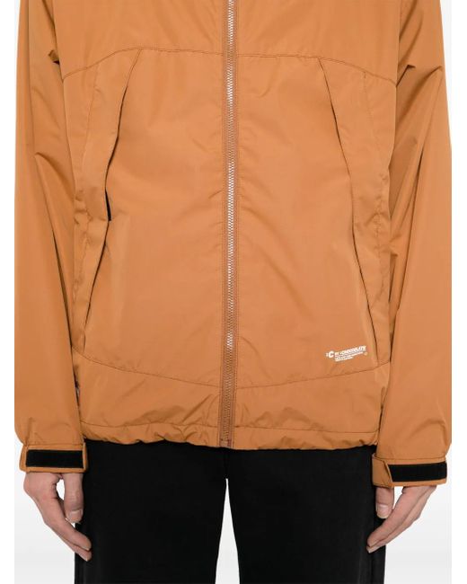 Cortavientos Con Capucha Chocoolate de hombre de color Orange