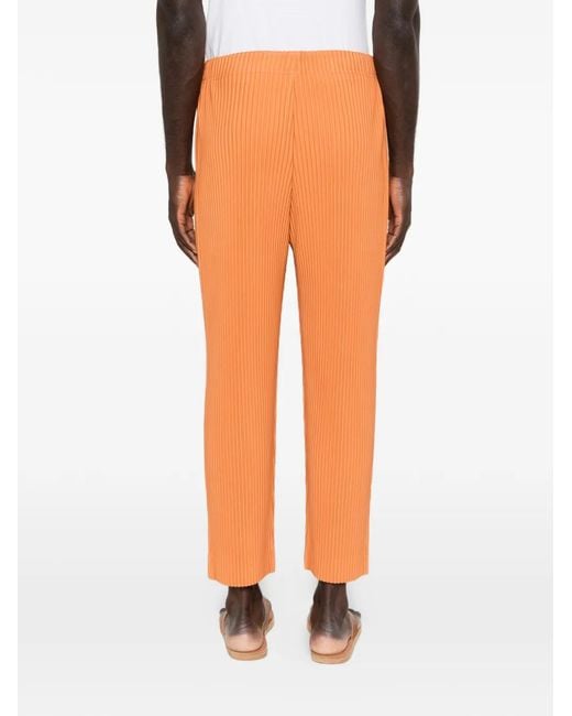 Homme Plissé Issey Miyake Orange Pleated Slim Trousers for men