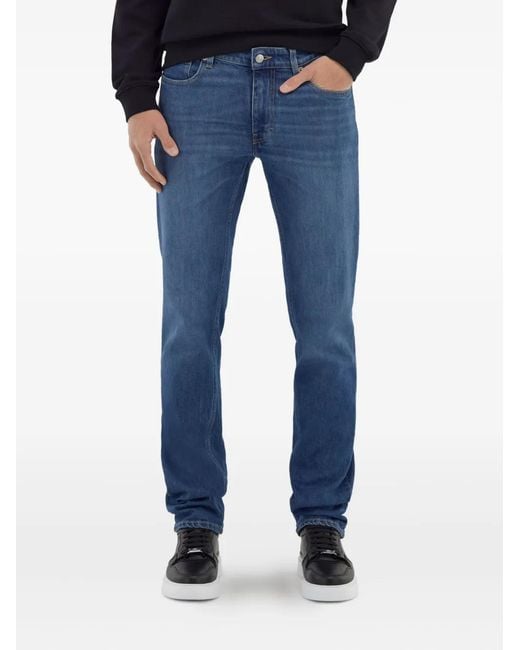 Roberto Cavalli Blue Logo-Appliqué Skinny-Cut Jeans for men