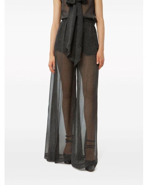 Pantalones palazzo con lunares Nina Ricci de color Black