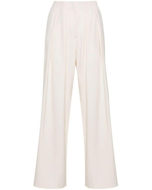 Pantalones palazzo con pliegues Maje de color White