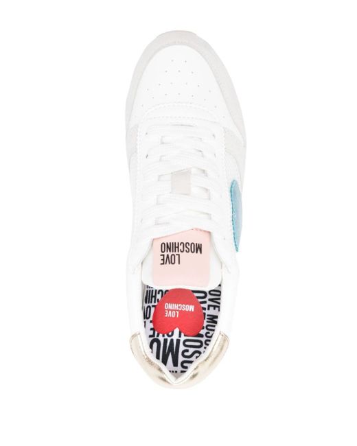 Sneakers con inserti di Moschino in White