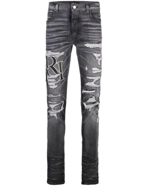 Logo-print ripped skinny jeans Amiri de hombre de color Gray