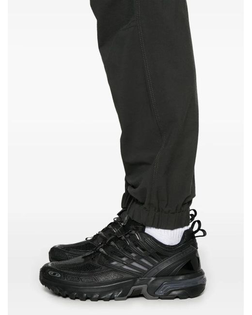 Pantalon À Chevilles Élastiquées Stone Island pour homme en coloris Black