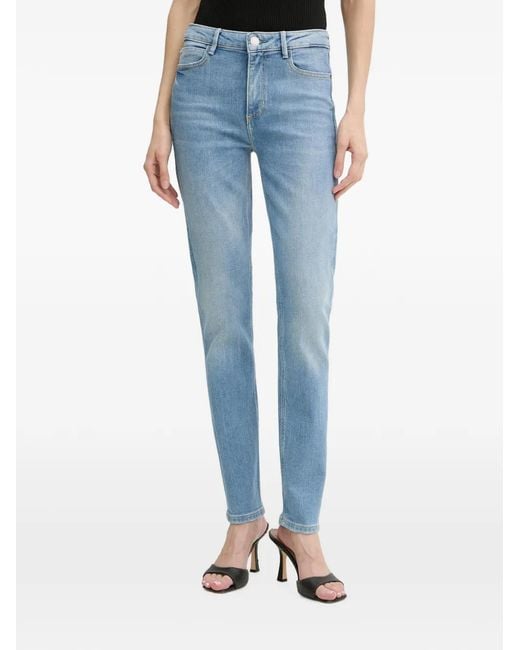 Jean Slim 1981 À Patch Logo Guess en coloris Blue