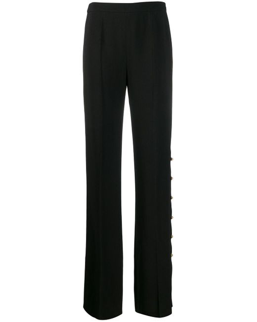 Pantaloni con bottoni laterali di Prada in Nero | Lyst