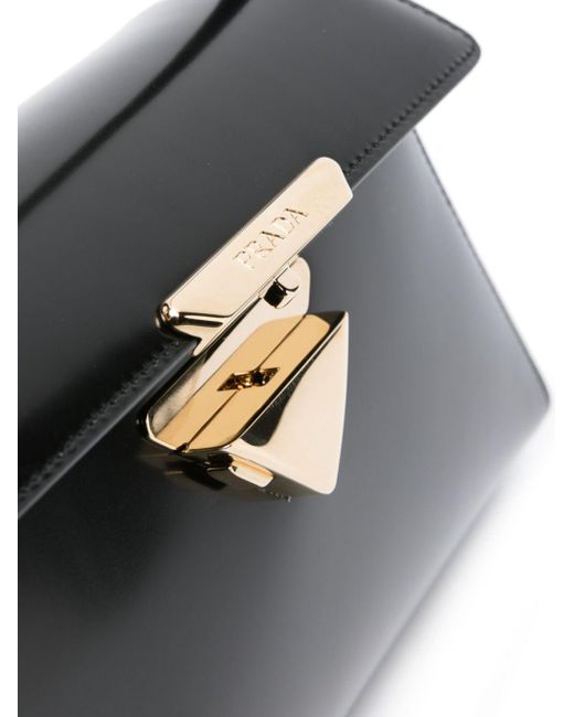 Bolso de hombro con logo triangular Prada de color Black