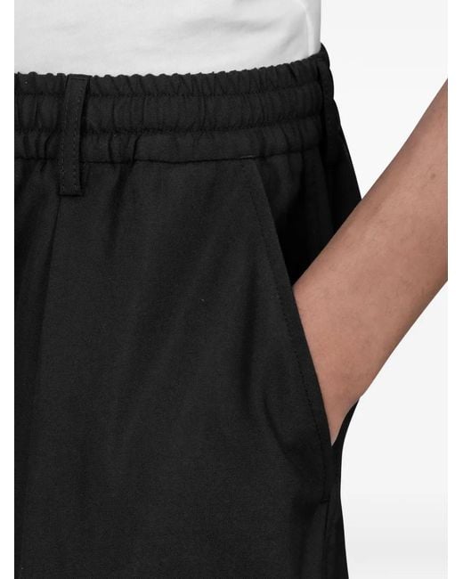 Universal Works Black Pleated Trousers for men