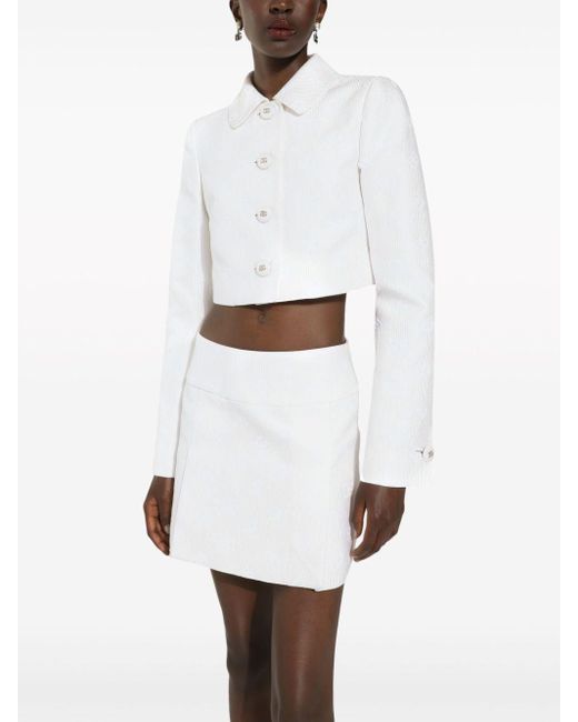 Minijupe plissée à logo jacquard Dolce & Gabbana en coloris White