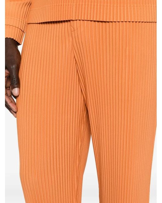 Homme Plissé Issey Miyake Orange Pleated Slim Trousers for men