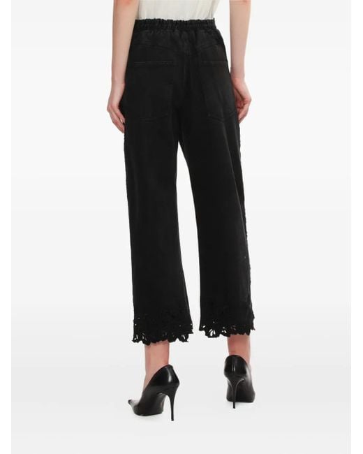 Vaqueros con encaje floral Sea de color Black