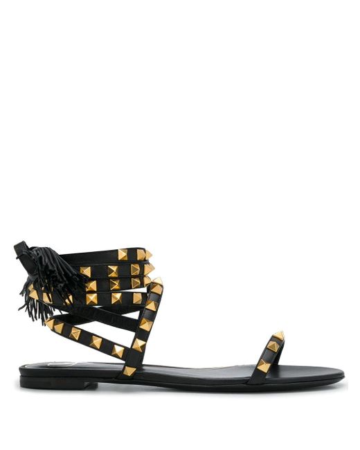 Valentino Garavani Leather Valentino Garavani Rockstud Flair Nappa Flip-flop Sandal in Black