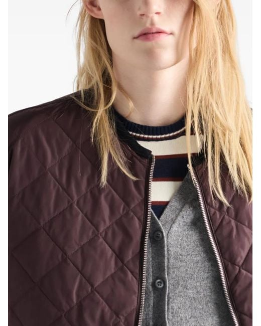 Plumífero con logo triangular Prada de color Brown