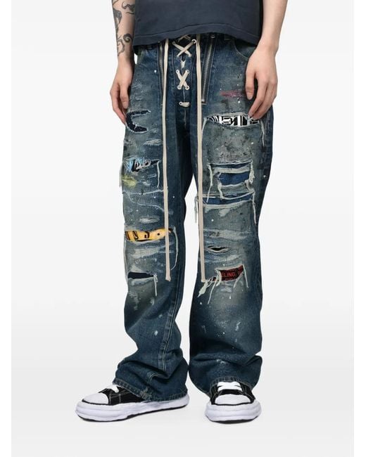 JUN/NAKAYAMA Blue X Overdesign Distressed Lace-Up Jeans for men
