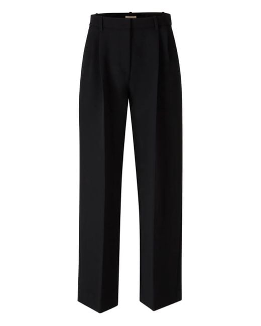 Khaite Black High-Waist-Hose mit Bundfalten
