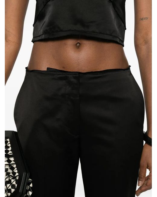 Totême Black Kick Flare Trousers