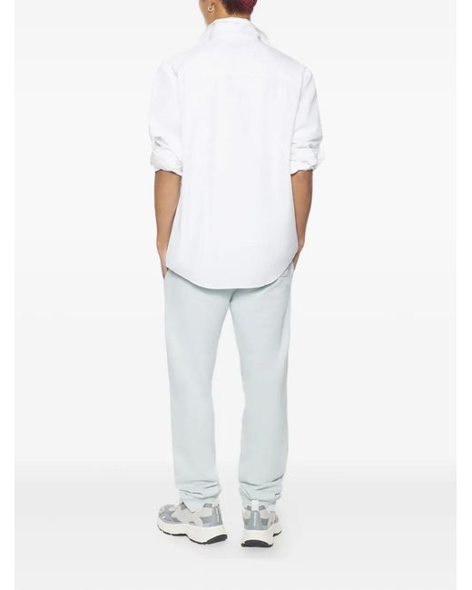 Maison Kitsuné White Logo-Patch Trousers for men