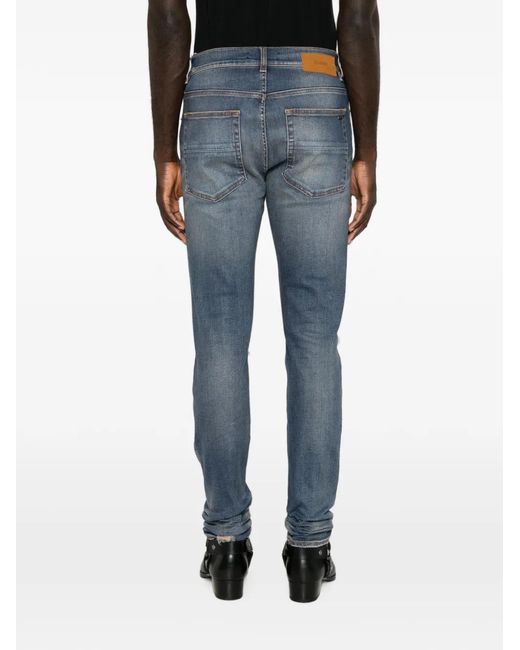 Amiri Blue Distressed Patchwork Jeans for men