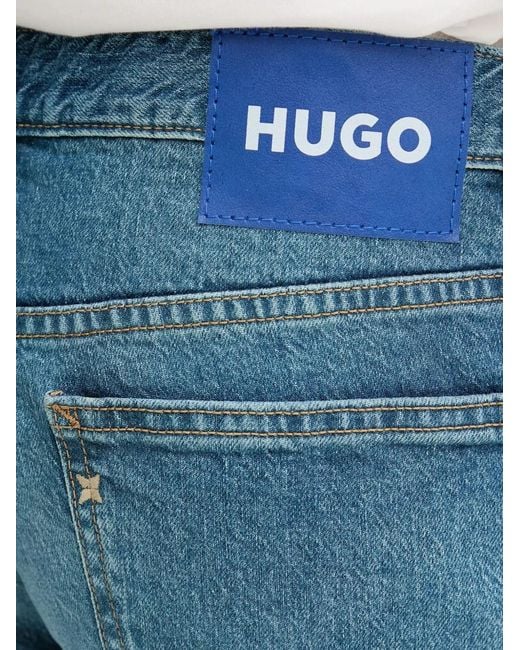 HUGO Blue Logo-Patch Button-Fastening Jeans for men