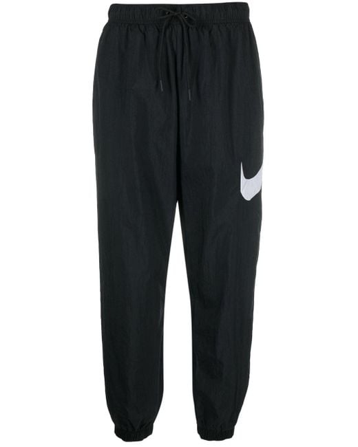 Nike Swoosh-print Track Pants in Black - Lyst