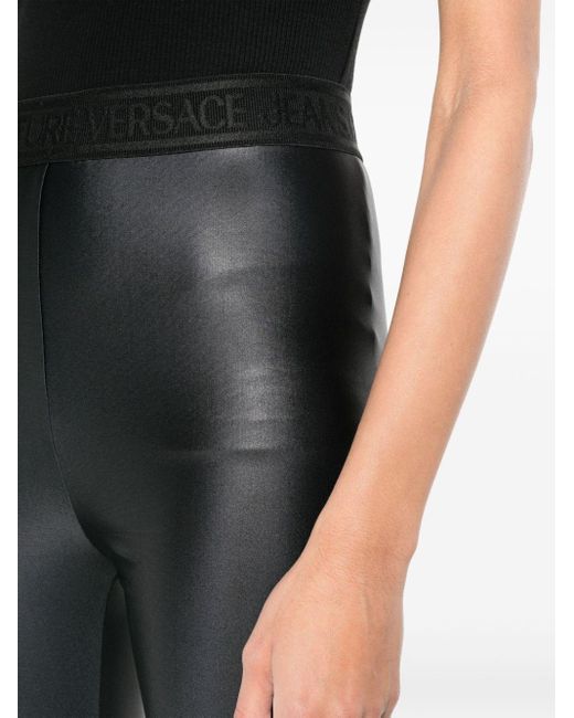 Legging taille haute à bande logo Versace en coloris Black
