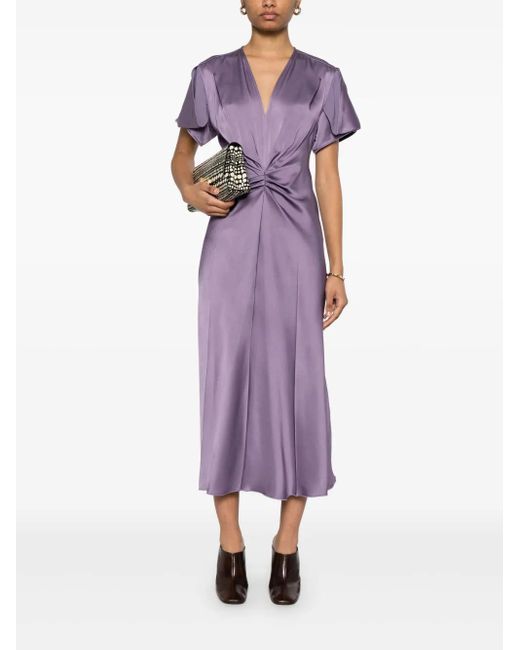 victoria beckham purple dress and David rewear their iconic wedding outfits This model This model impresses with its fashionable fitnflare fit Midi-length Victoria Beckham Dress 